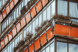 Modernist orange building Tineo, an Architecture Photo by SkyNext