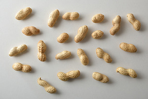 Background of a pile of peanuts in shell top view, a Food & Drink Photo by Davizro's Market