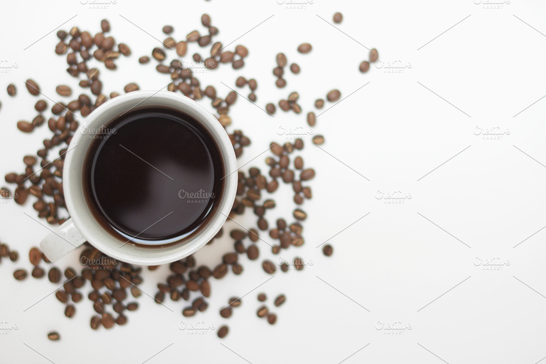 Cup of Coffee & Coffee Beans, a Background Photo by Stitch & Shutter Stock
