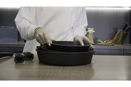 Restaurant. Frying pans. Action, a Person Photo by Media Whale Stock