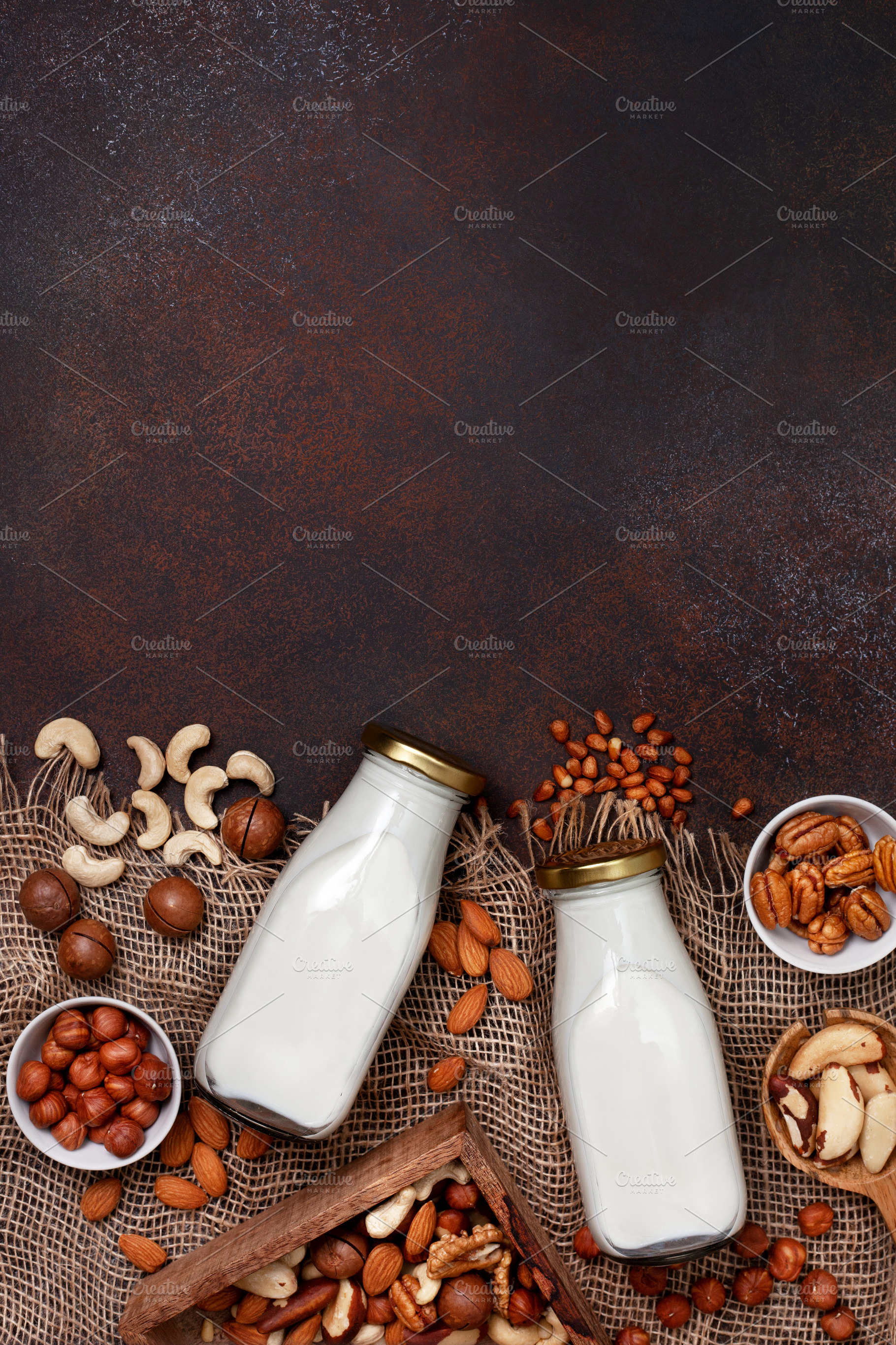 Nut milk in glass bottles stock photo containing milk and vegan, a Food & Drink Photo by natashamam