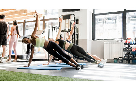 Group of people doing side plank, a Sports & Recreation Photo by Daniel Megias