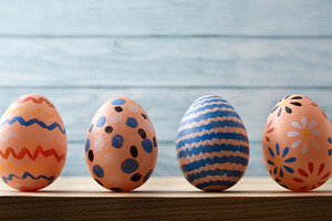 Hand-Painted Easter Eggs on Wooden Background, a Holiday Photo by Davizro's Market