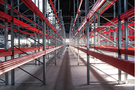 Warehouse with empty high pallet, an Industrial Photo by Jan Jack Russo Media