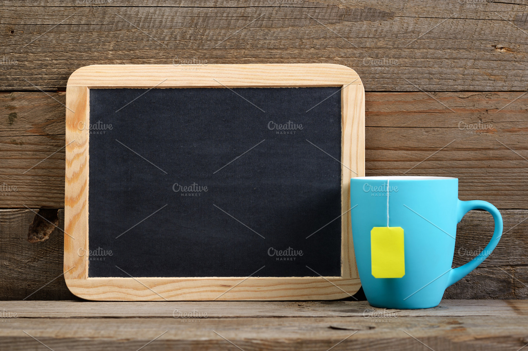 Cup of tea and small blackboard