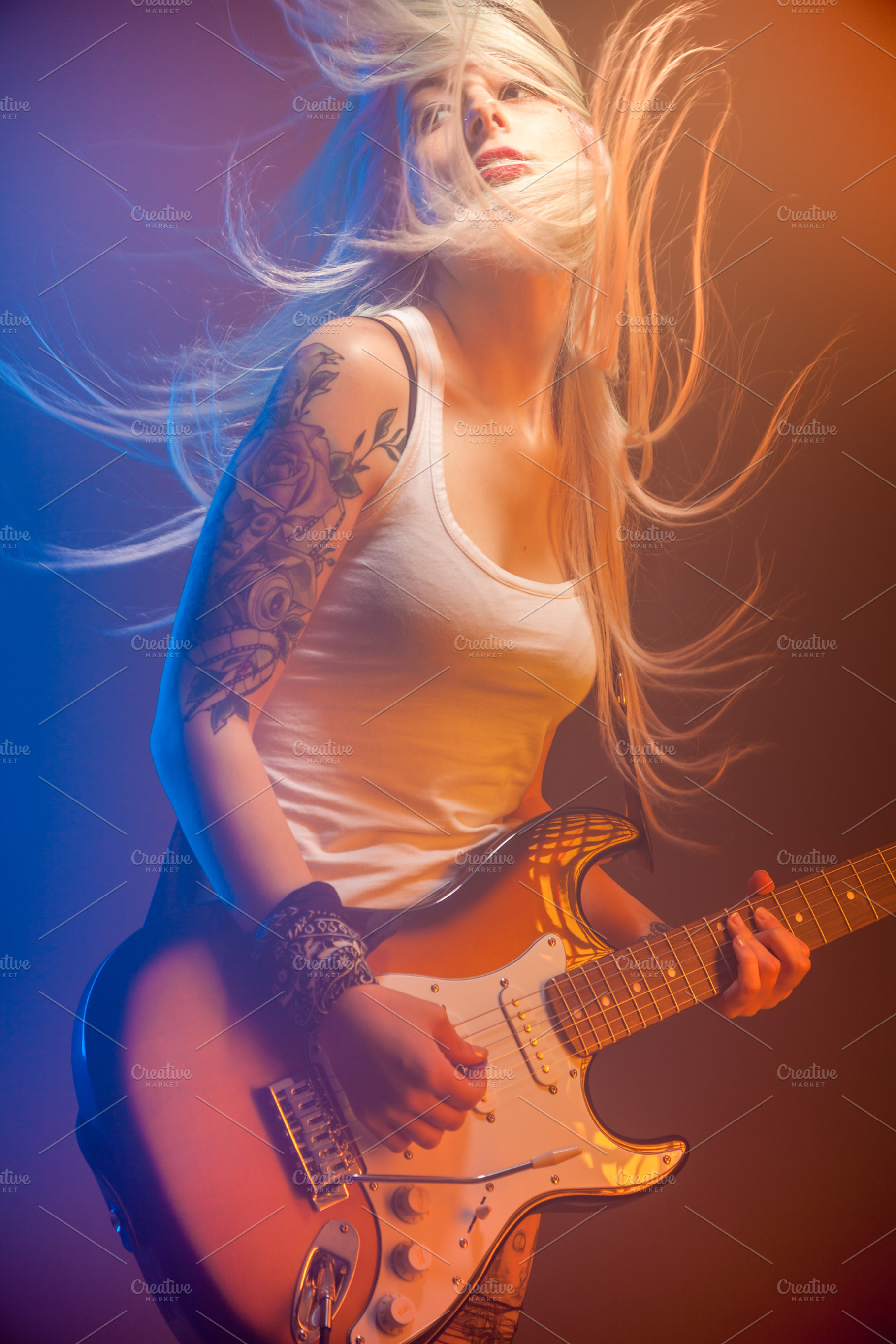 Woman playing electric guitar stock photo containing electric guitar and, an Arts & Entertainment Photo by Ernesto Solla