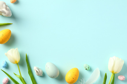 Happy Easter background with tulips and colorful eggs. Flat lay, top view., a Holiday Photo by photoguns