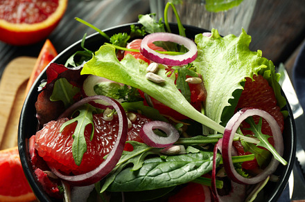 Concept of tasty food, salad with red orange, close up, a Food & Drink Photo by AtlasStudio PRO