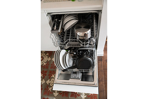 Fully loaded dishwasher featuring, a Technology Photo by volodymyrshtun13795