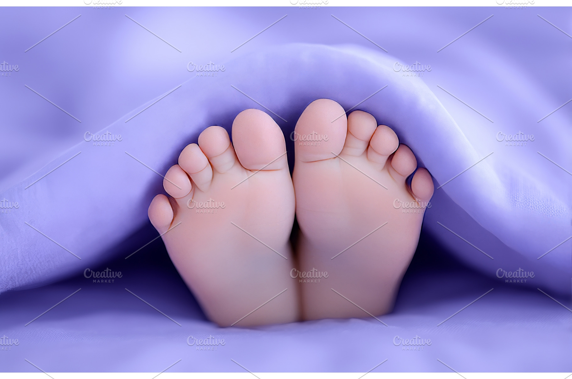 A baby girl's feet are wrapped in a, a Person Photo by ZinetroN