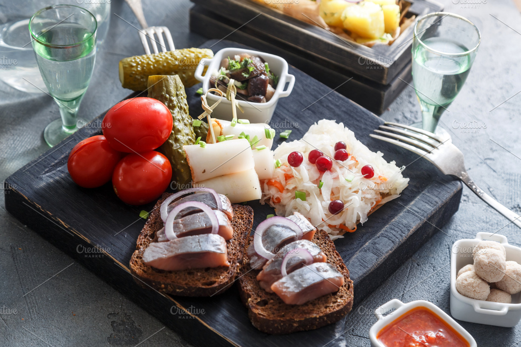 Vodka with various traditional snacks and appetizers pickled cabbage cucumber, a Food & Drink Photo by Konstantin K.