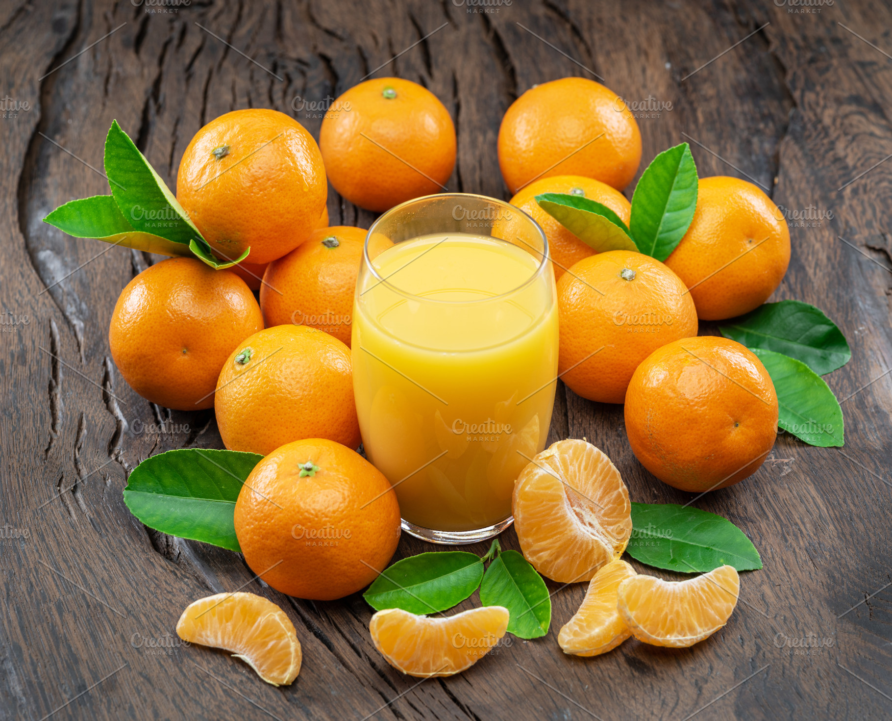 Orange tangerine fruits and glass of fresh tangerine juice on da, a Food & Drink Photo by Volff