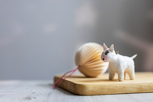Small white bull terrier dog figurin, a Wallpaper Photo by Imaginarium