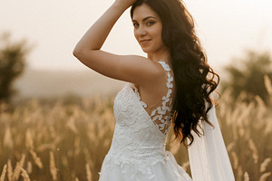 girl are walking in the green hills, a Person Photo by Weddings, People, Travel