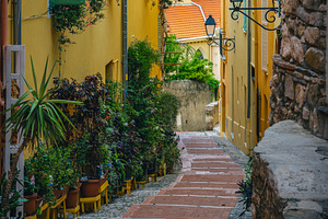 Narrow street with stairs in France, an Architecture Photo by Alpine Dreams