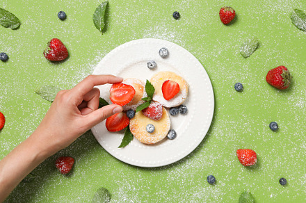 Concept of tasty sweet food, cheese pancakes, top view, a Food & Drink Photo by AtlasStudio PRO