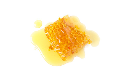 Fresh honeycomb piece isolated on white background, a Food & Drink Photo by AtlasStudio PRO