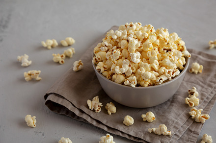 Homemade Salty Popcorn in a Bowl, side view., a Food & Drink Photo by LiudmylaChuhunova