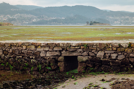 Roman bridge with a water door on an abandoned salt flats, a Nature Photo by rubenchase