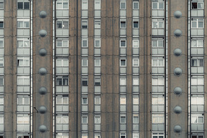 Brutalist apartment facade symmetry, an Architecture Photo by SkyNext