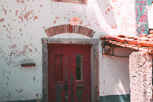 Rustic house with red gate, an Architecture Photo by SkyNext