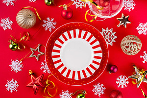 Christmas, New Year table setting with plate and Xmas ornaments