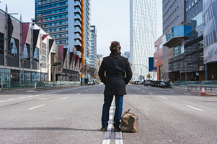 Man standing alone in the street stock photo containing action and alone