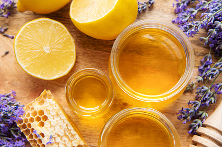 Jar with honey and fresh lavender flowers, a Food & Drink Photo by Olena Rudo