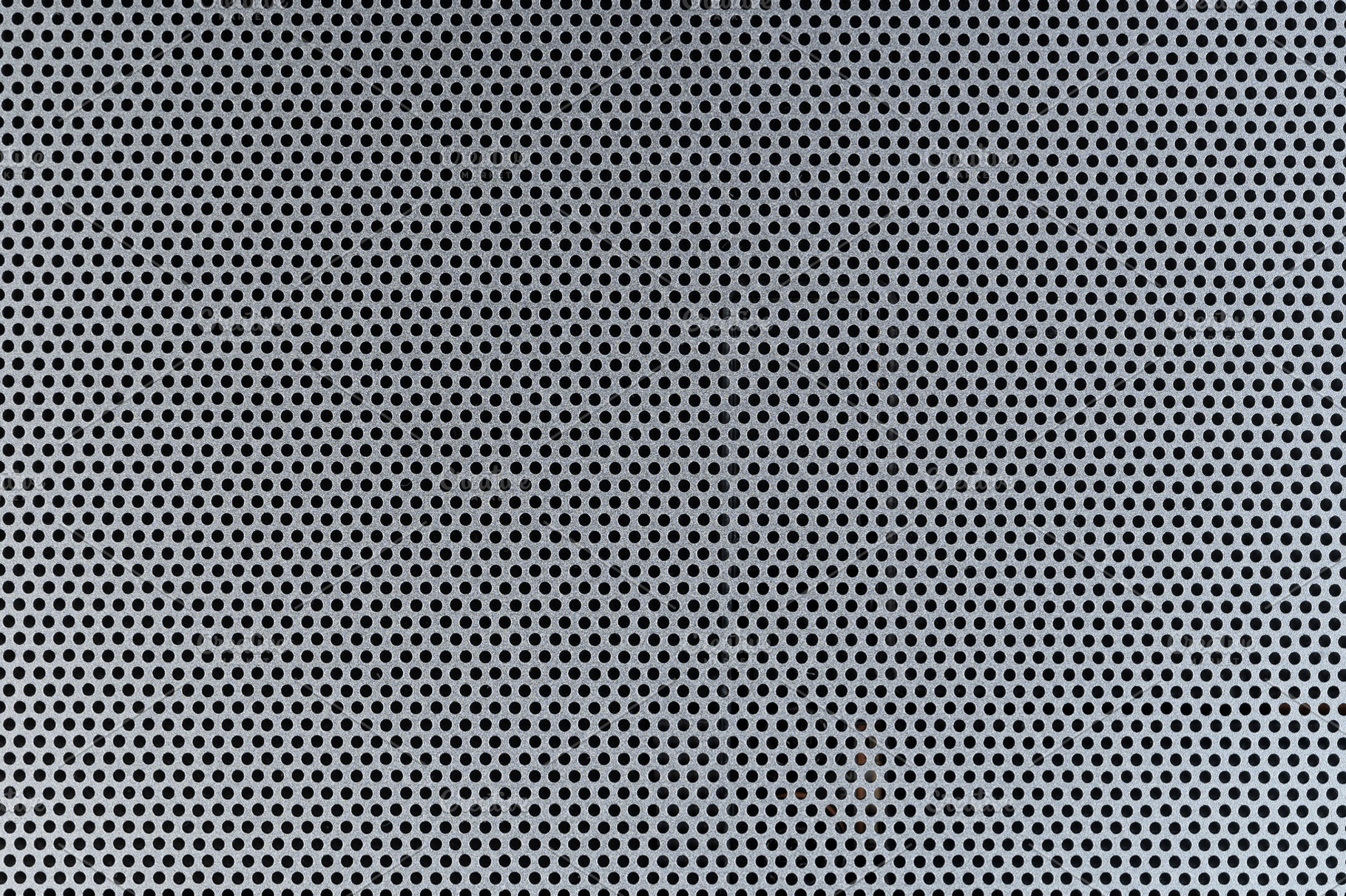 Pattern of round holes in metal, an Abstract Photo by PixieMe