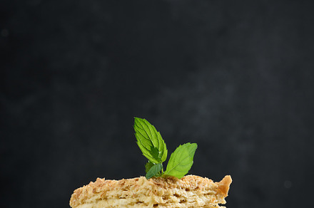 A stack of baked Napoleon pie slices with cream. Puff pastry, delicious dessert, a Food & Drink Photo by ndanko