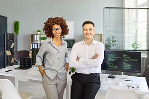 Two Smiling Developers in Office