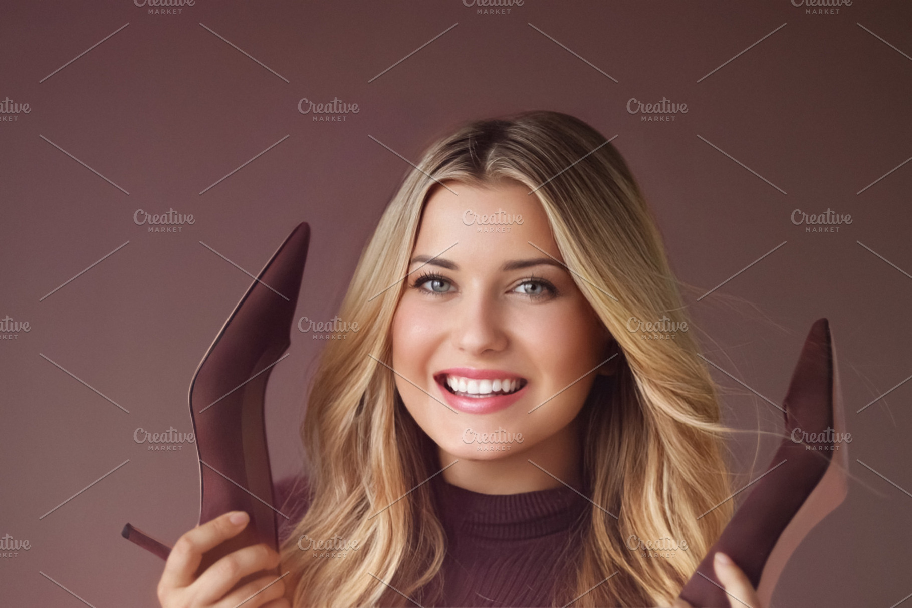 Blonde woman smiling, holding elegant high heels. Expressing hap, a Person Photo by Studio ANNA
