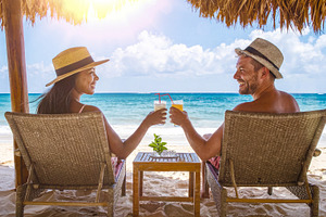 Couple Toasting Drinks on Tropical Beach, a Sports & Recreation Photo by Davizro's Market
