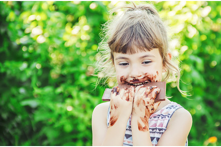 A sweet-toothed child eats chocolate, a Person Photo by yanadjana