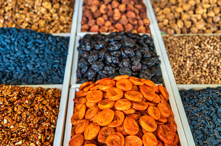 Oriental dried fruits and nuts on the counter of the bazaar., a Food & Drink Photo by Eugene_Photo