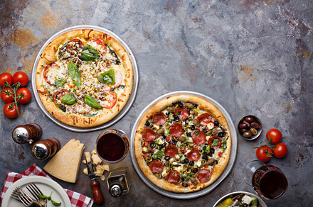 Pizza Margarita and Pepperoni with garnishes, a Food & Drink Photo by farwasser