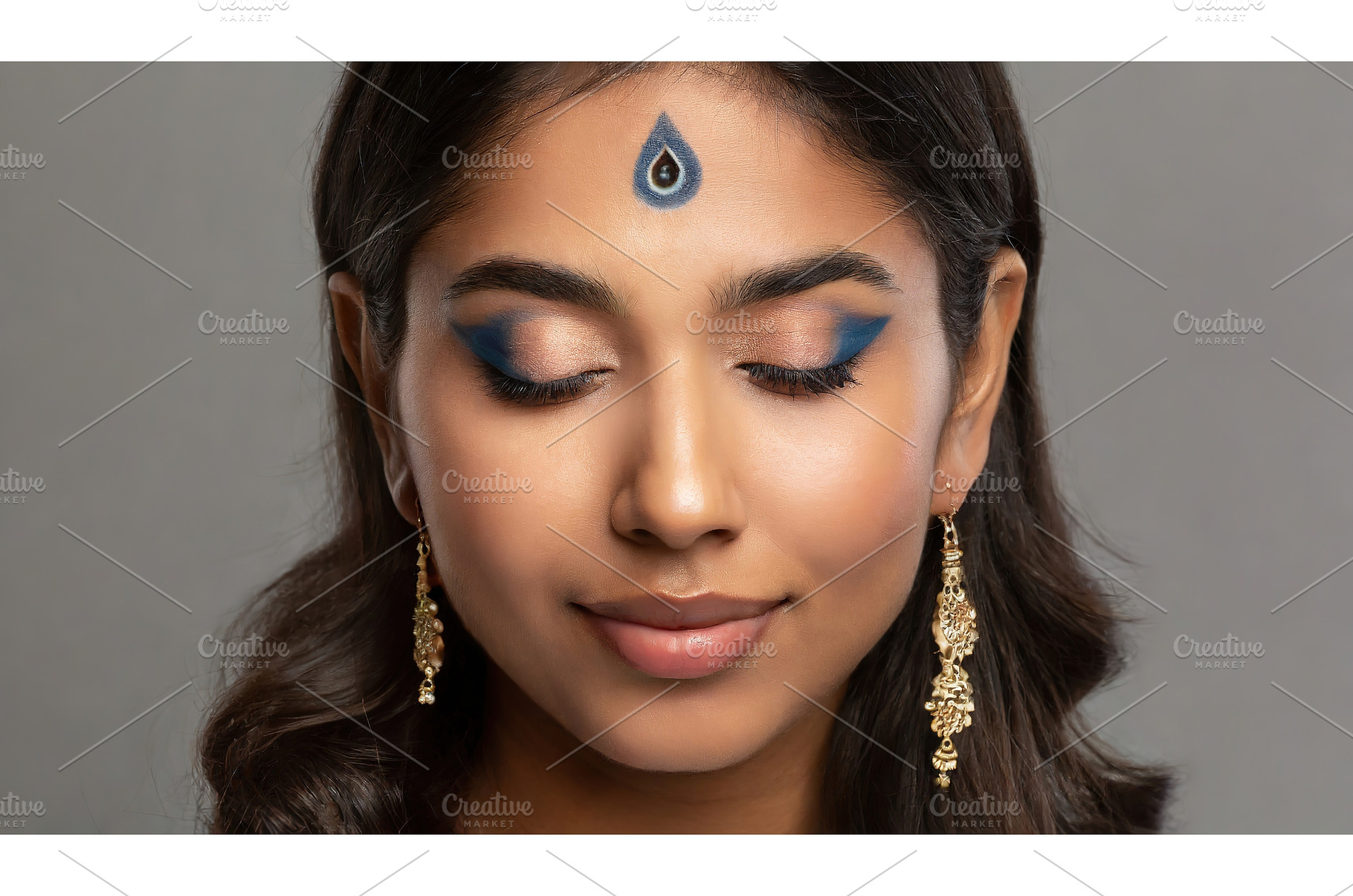 A serene woman with artistic blue, a Beauty & Fashion Photo by Igor Tichonow