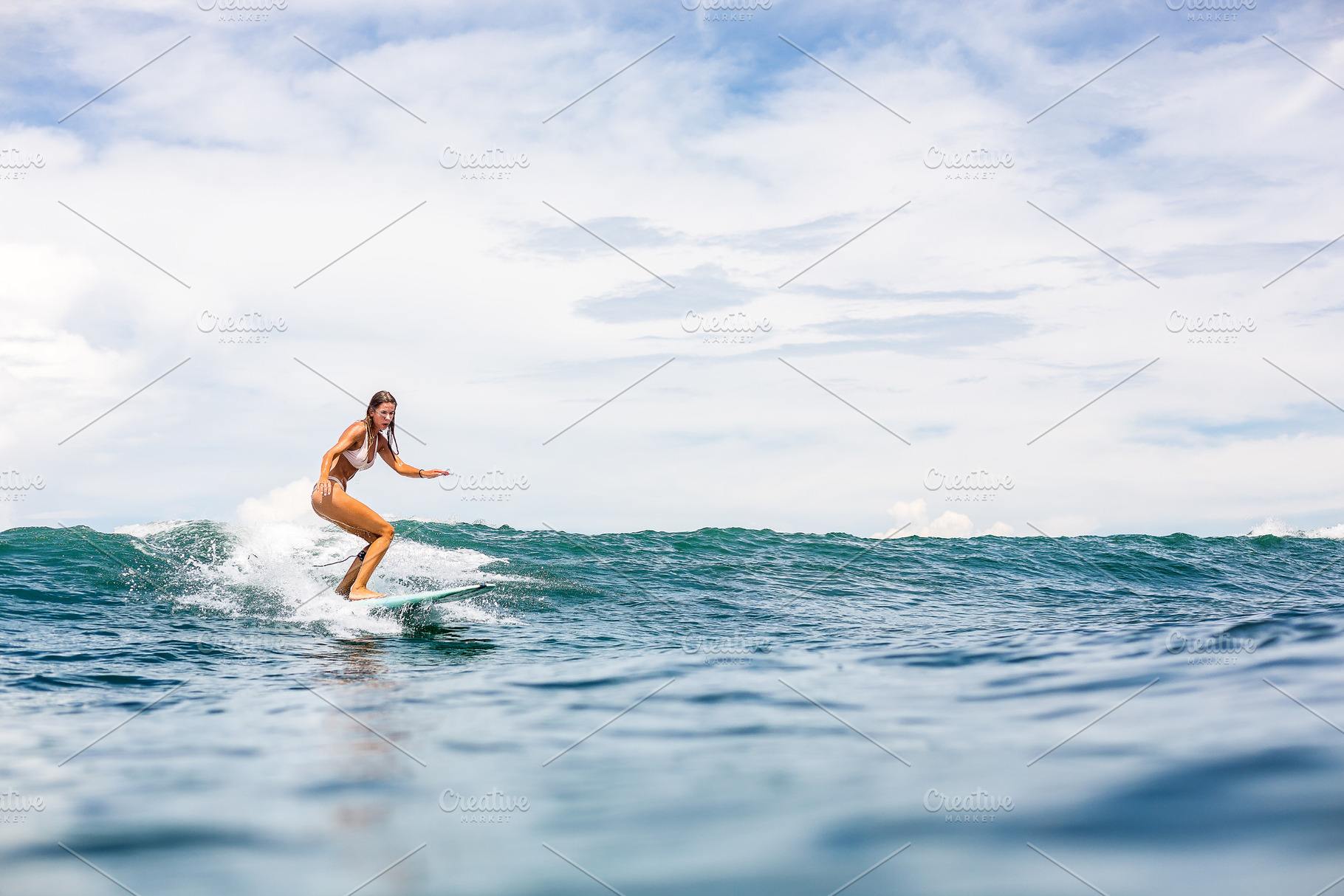 Surfing all day long stock photo containing beach and surf, a Sports & Recreation Photo by Mikalai