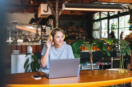 Young woman working at cafe, a Technology Photo by Galina_Zhigalova