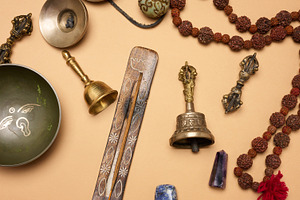 Tibetan singing copper bowl with a wooden clapper on a brown bac, a Background Photo by ndanko