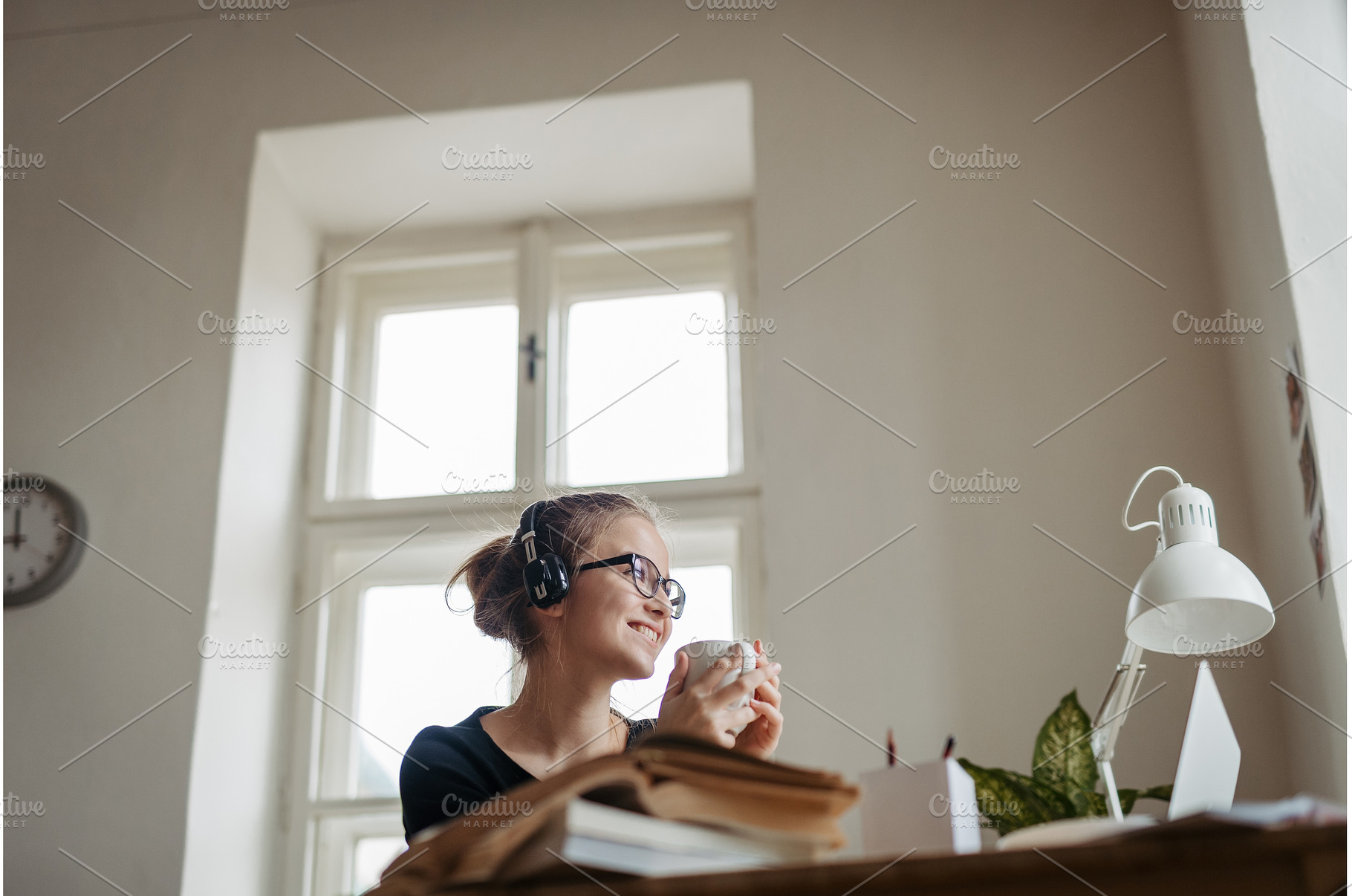 Young female student having cup of, a Person Photo by HalfPoint
