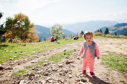 Cute baby girll waliking in mountains. Little discoverer., a Nature Photo by AS photostudio