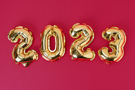 Viva magenta color of the year 2023. New Year 2023. Foil balloons numbers 2023