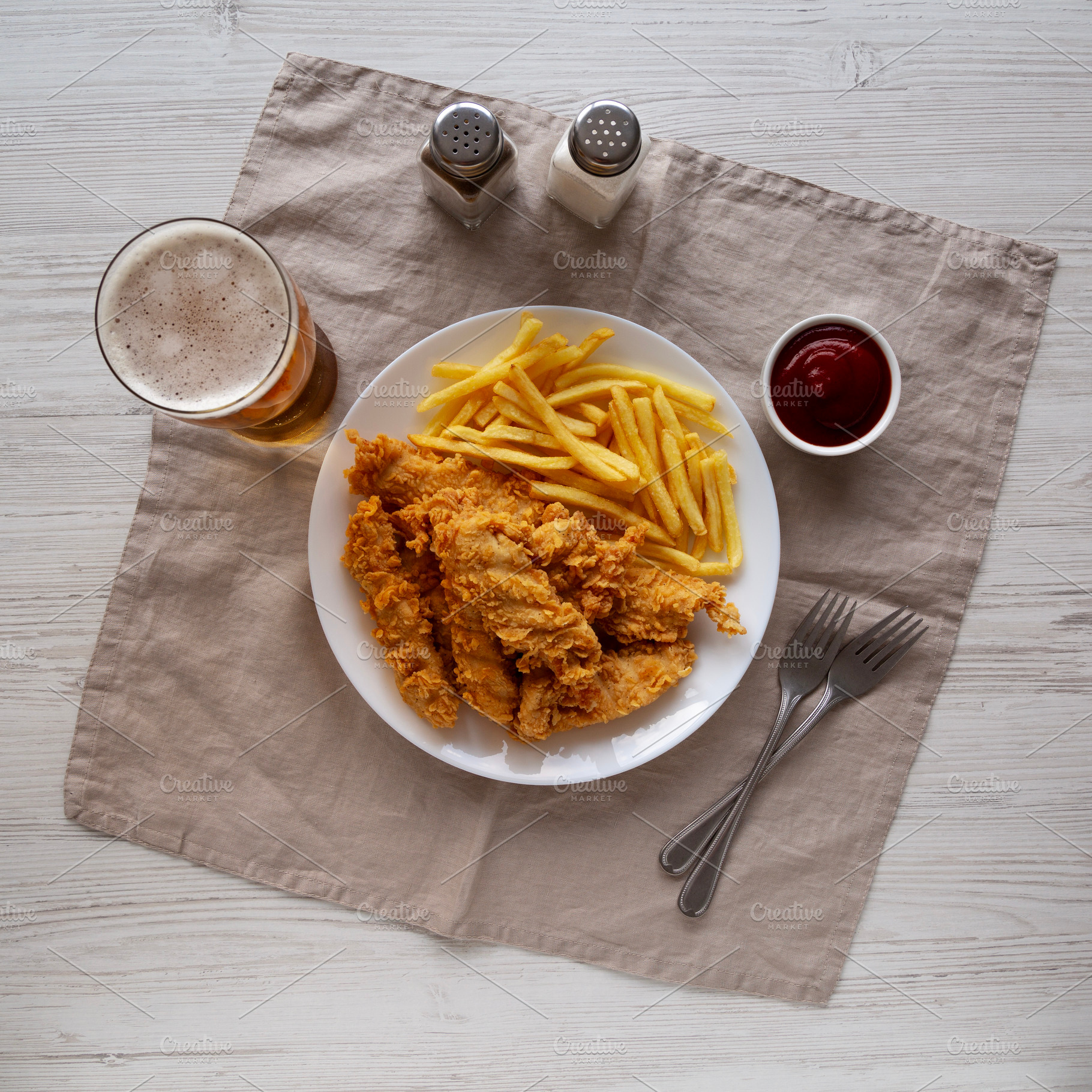 Homemade Chicken Strips with Fries on a Plate, top view. Flat la, a Food & Drink Photo by LiudmylaChuhunova