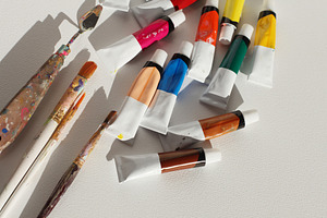Acrylic paints in tubes and brushes, an Arts & Entertainment Photo by Liliia Rudchenko