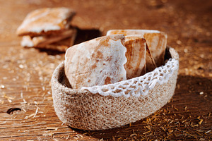 mostaccioli arranged inside a woven basket, a Photo by Nito
