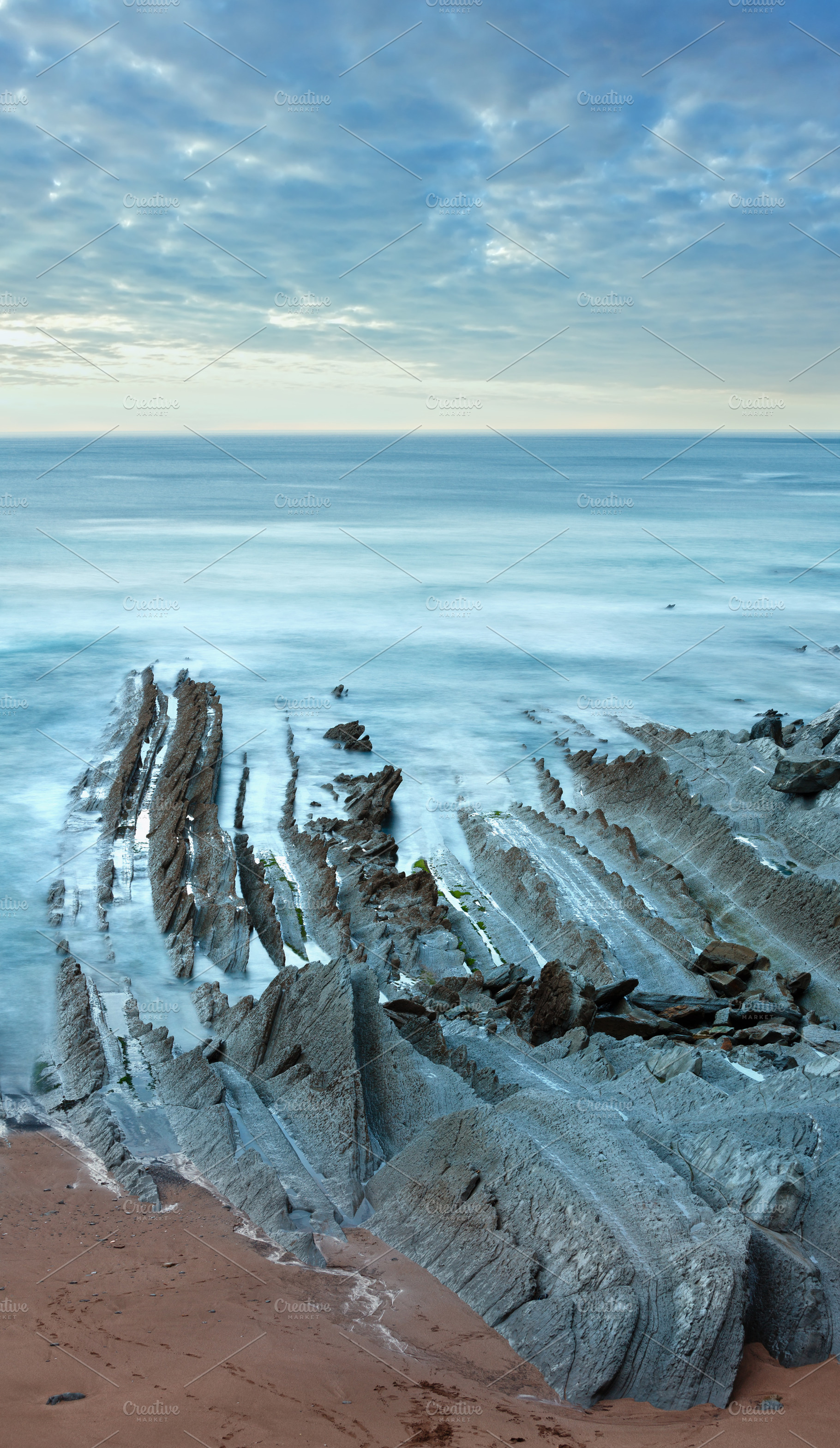 Twilight ocean coast with ribbed stratiform rock., a Nature Photo by YuriyB