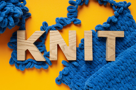 Concept of hobby, cozy hobby, knitting, top view, a Beauty & Fashion Photo by AtlasStudio