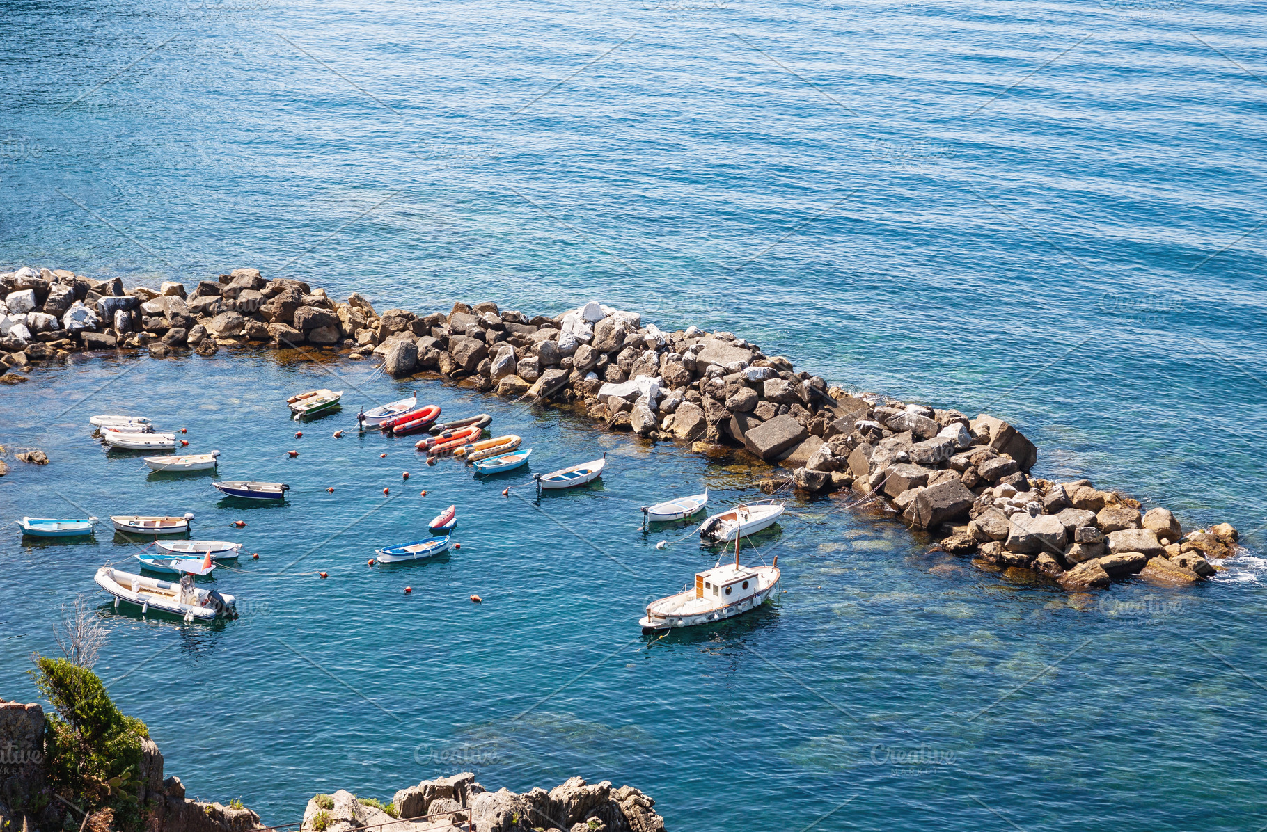 Boats moored in small sea harbor, a Nature Photo by BOOCYS