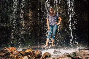 Woman Standing Behind a Flowing, a Person Photo by Jan Jack Russo Media